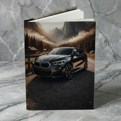 BMW X2 Parked Against Misty Mountain Backdrop