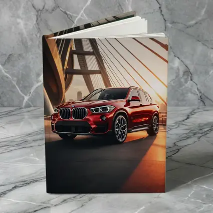BMW X1 Red SUV on Sunset Bridge