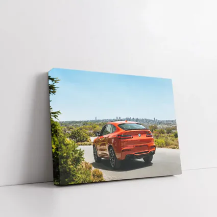 BMW X4 M Orange Rear City Skyline