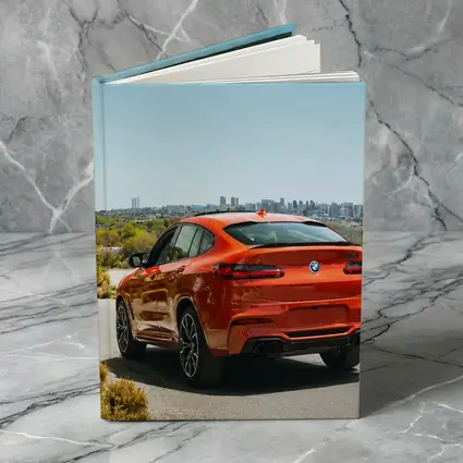 BMW X4 M Orange Rear City Skyline