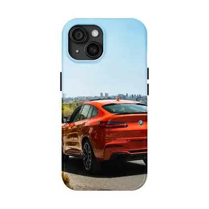 BMW X4 M Orange Rear City Skyline