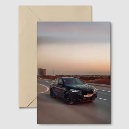 BMW X4 M Black On Open Highway Sunset