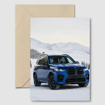 BMW X5M Blue SUV Snowy Mountain Setting