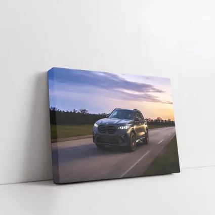 BMW X5M Matte Black Driving Sunset Road
