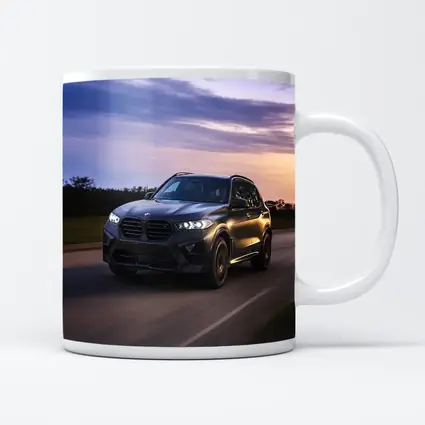 BMW X5M Matte Black Driving Sunset Road
