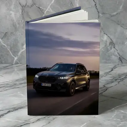 BMW X5M Black SUV Dusk Road Drive