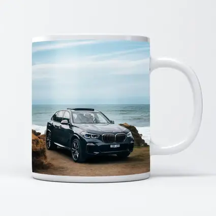 BMW X5 Parked by Coastal Rocky Shore