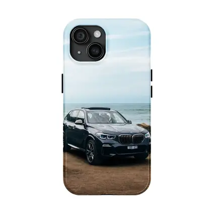 BMW X5 Parked by Coastal Rocky Shore