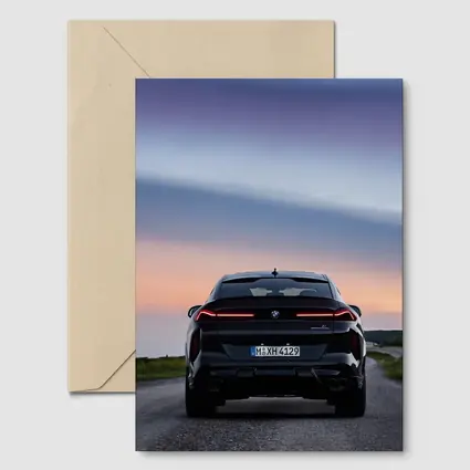 BMW X6 M Black Rear Sunset Road