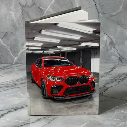 Red BMW X6 M Parked Indoor Garage