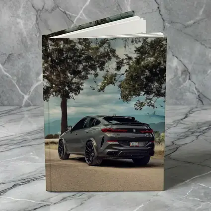 BMW X6M Matte Gray Mountain Road Scene