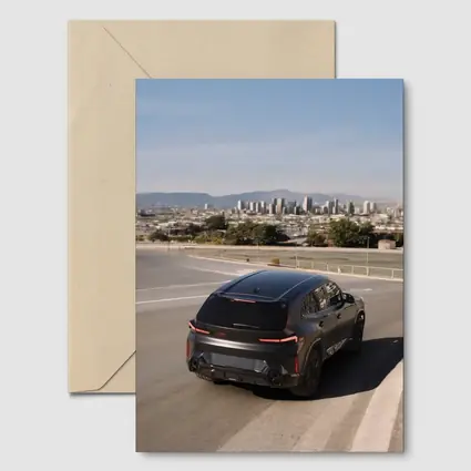 BMW XM Black SUV City Skyline Road