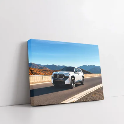 BMW XM SUV on Mountain Highway Road