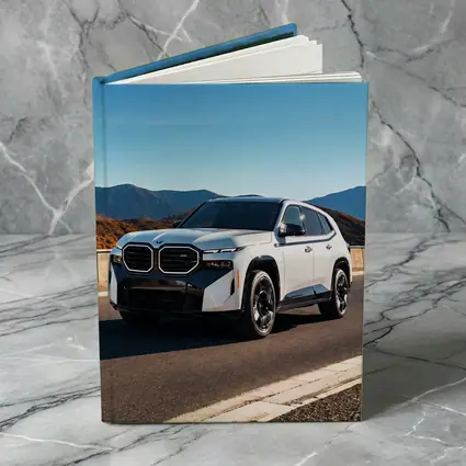 BMW XM SUV on Mountain Highway Road