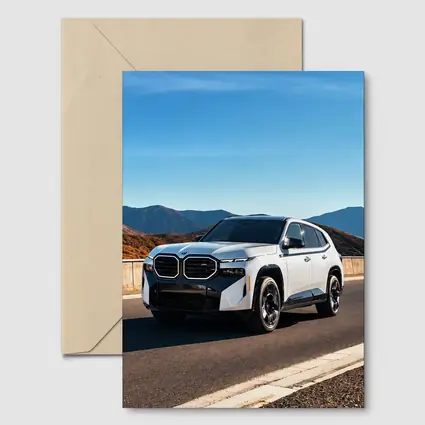 BMW XM SUV on Mountain Highway Road