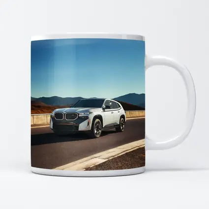 BMW XM White SUV Mountain Highway Drive