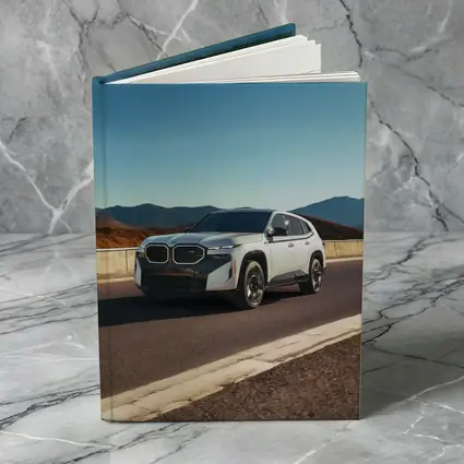 BMW XM White SUV Mountain Highway Drive
