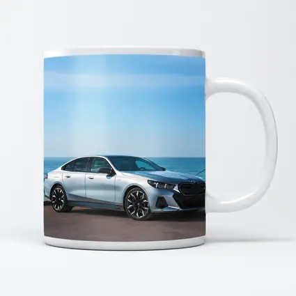 BMW i5 Silver Sedan By The Ocean