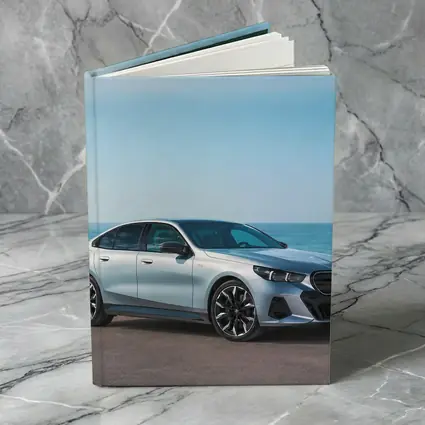 BMW i5 Silver Sedan By The Ocean