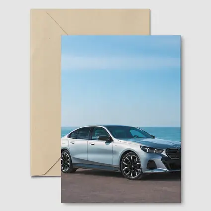 BMW i5 Silver Sedan By The Ocean