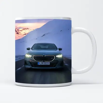 BMW i5 M60 Sedan Snowy Mountain Road