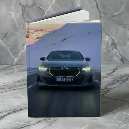 BMW i5 M60 Sedan Snowy Mountain Road