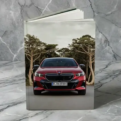 BMW i5 M60 Red Sedan Forest Road