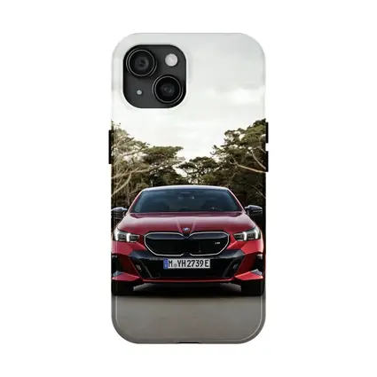BMW i5 M60 Red Sedan Forest Road