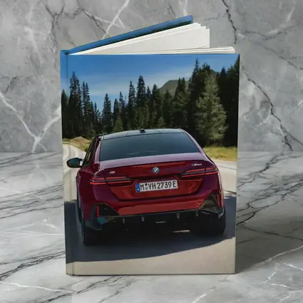 BMW i5 M60 Red Sedan Mountain Road