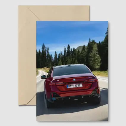 BMW i5 M60 Red Sedan Mountain Road