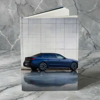 BMW i7 Blue Sedan Against Silver Wall