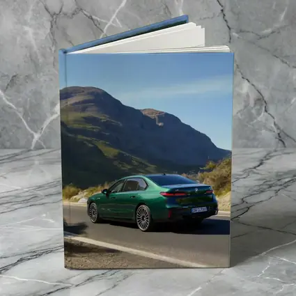 BMW i7 Green Sedan Mountain Road Drive