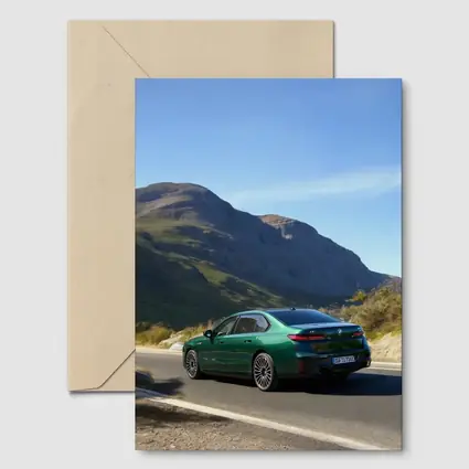 BMW i7 Green Sedan Mountain Road Drive