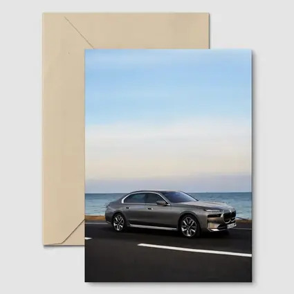 BMW i7 Gray Sedan by the Ocean