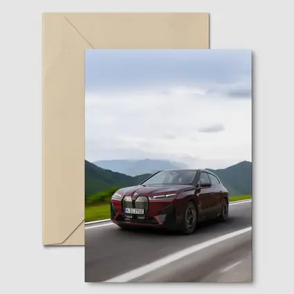 BMW iX Red SUV Mountain Road Drive