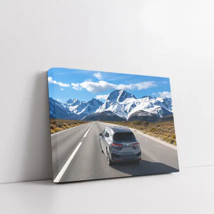 BMW iX SUV on Mountain Road