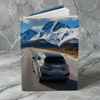 BMW iX SUV on Mountain Road