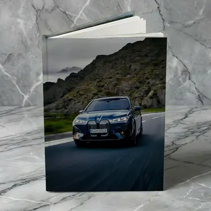BMW iX Driving Mountain Road Blue