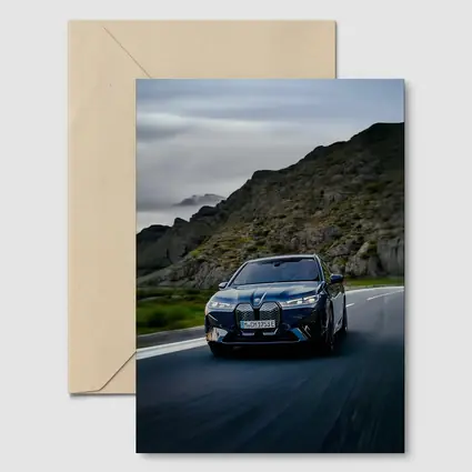 BMW iX Driving Mountain Road Blue