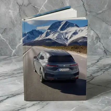 BMW iX Gray on Mountain Highway Road