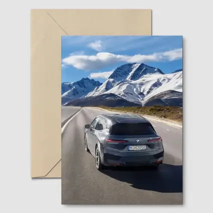 BMW iX Gray on Mountain Highway Road