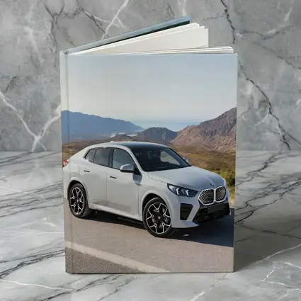 BMW iX2 White SUV Mountain Road