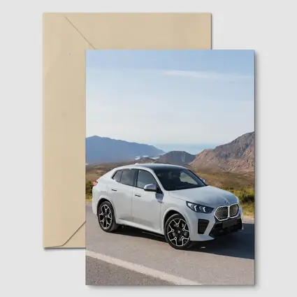 BMW iX2 White SUV Mountain Road