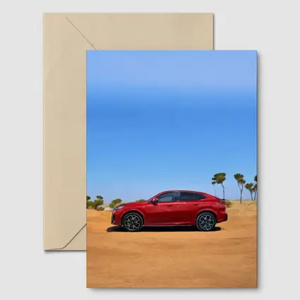 BMW iX2 Red Sandy Desert Blue Sky