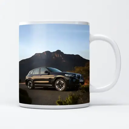 BMW iX3 Black SUV Mountain Backdrop