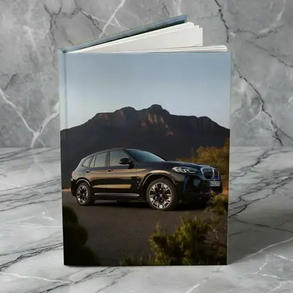 BMW iX3 Black SUV Mountain Backdrop