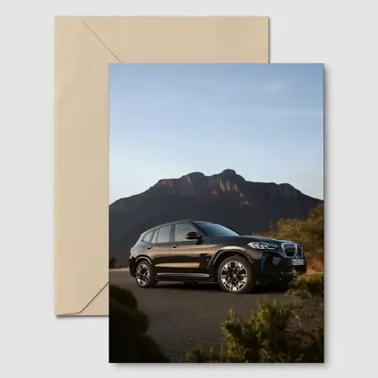BMW iX3 Black SUV Mountain Backdrop