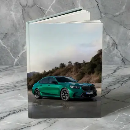 BMW M5 Green Sedan Hillside Setting