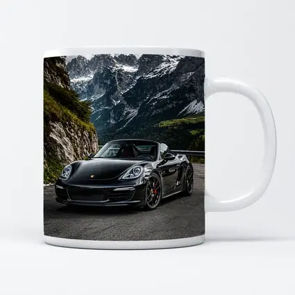 Black Porsche Boxster on Alpine Mountain Road