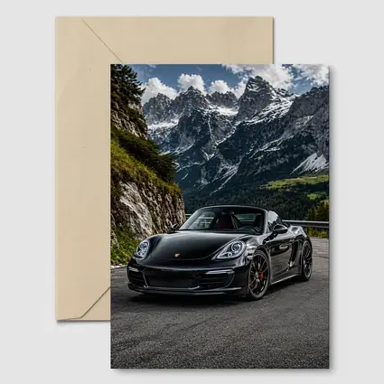 Black Porsche Boxster on Alpine Mountain Road